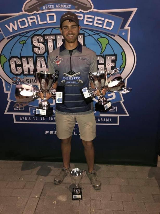 GRANT KUNKEL HOLDING MULTIPLE TROPHIES
